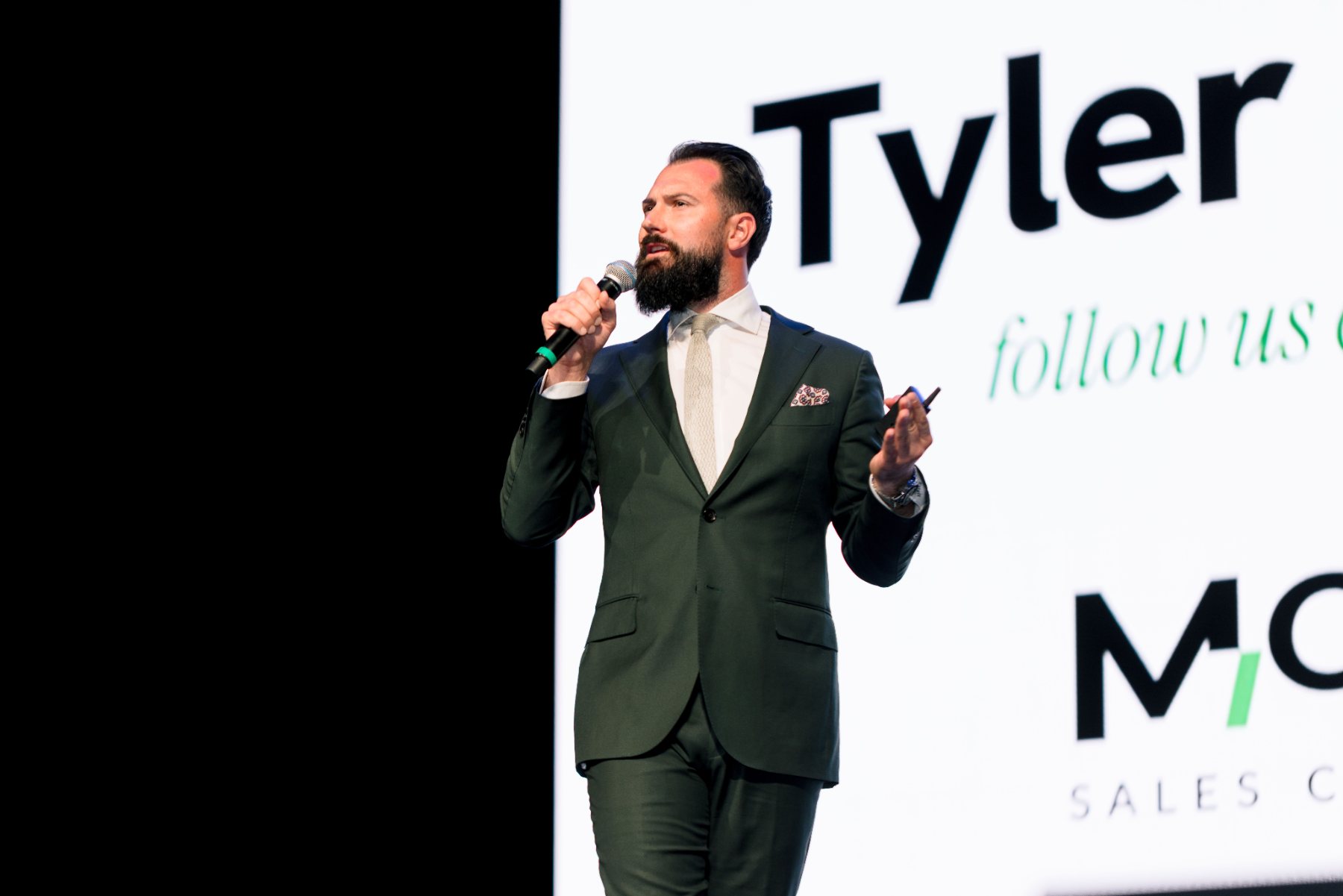 Tyler McLay speaking on stage at LIMITLESS 2026