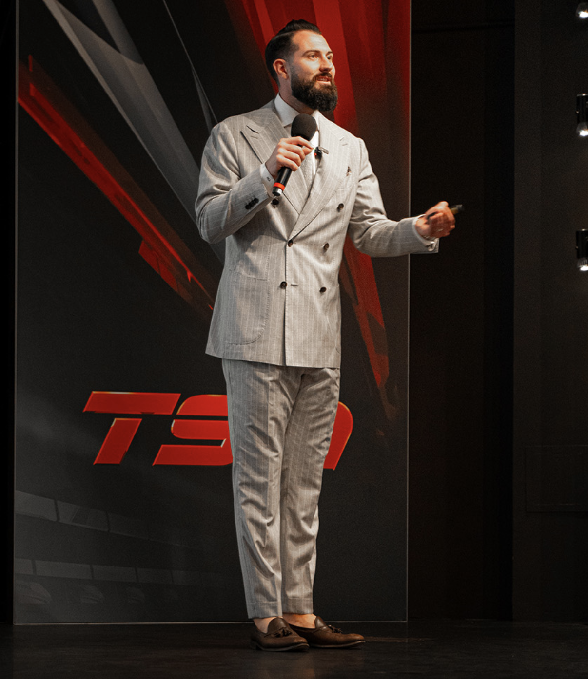 Tyler McLay speaking on stage